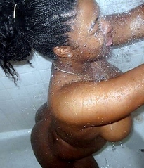 Topless ebony babe posing in sexy..